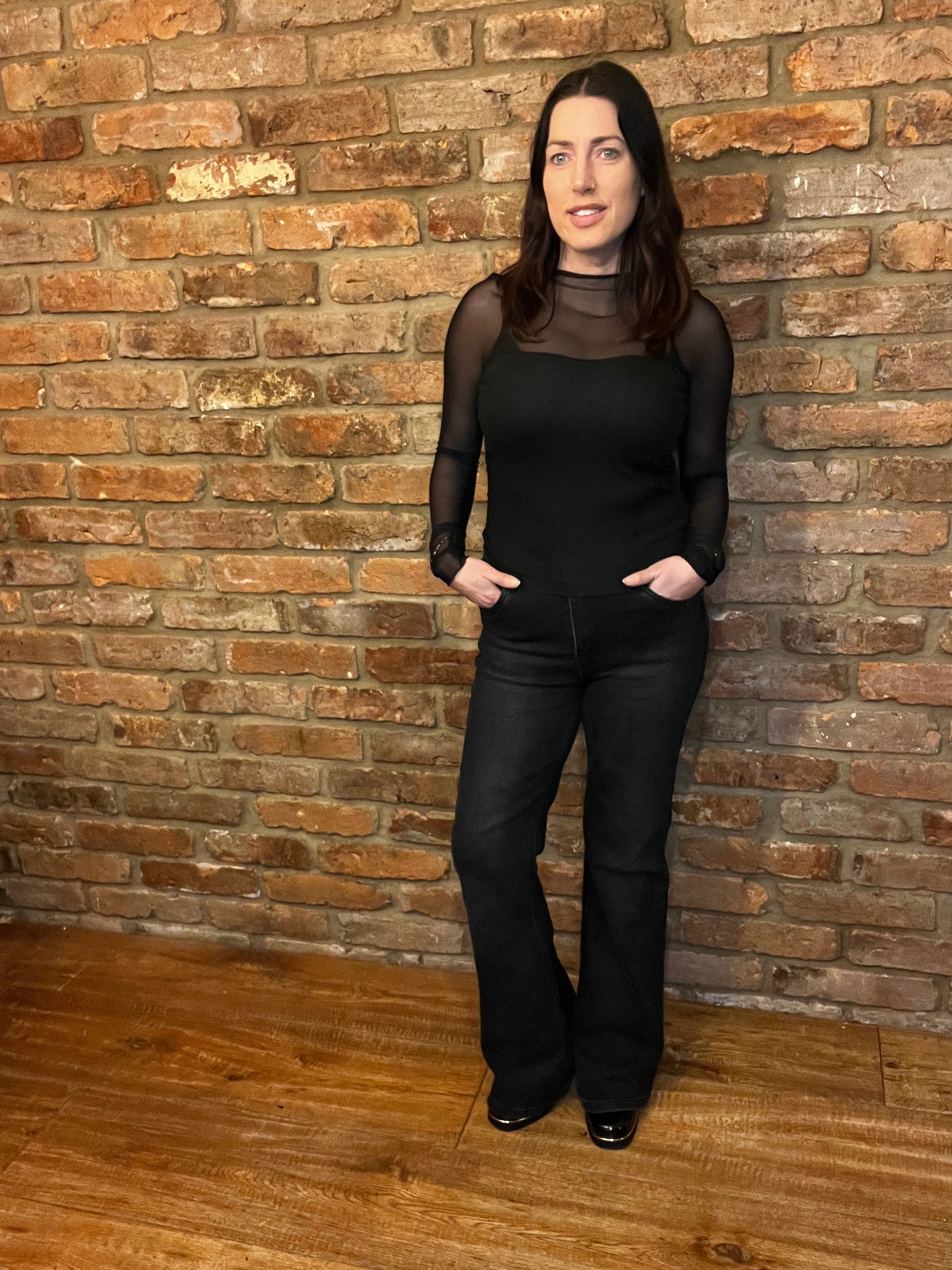 Black corset top with mesh sleeves