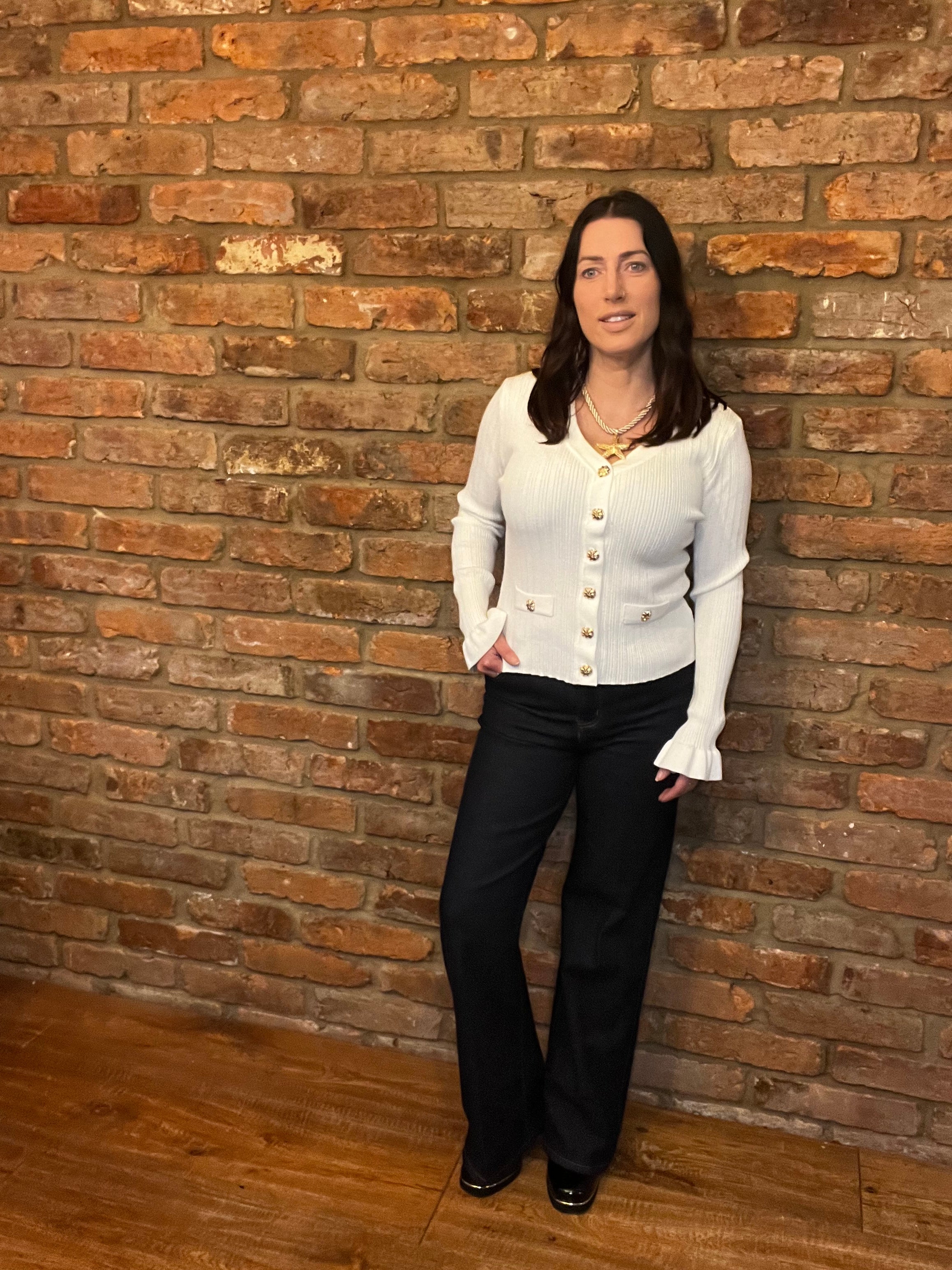 White knitted top with long frill sleeves