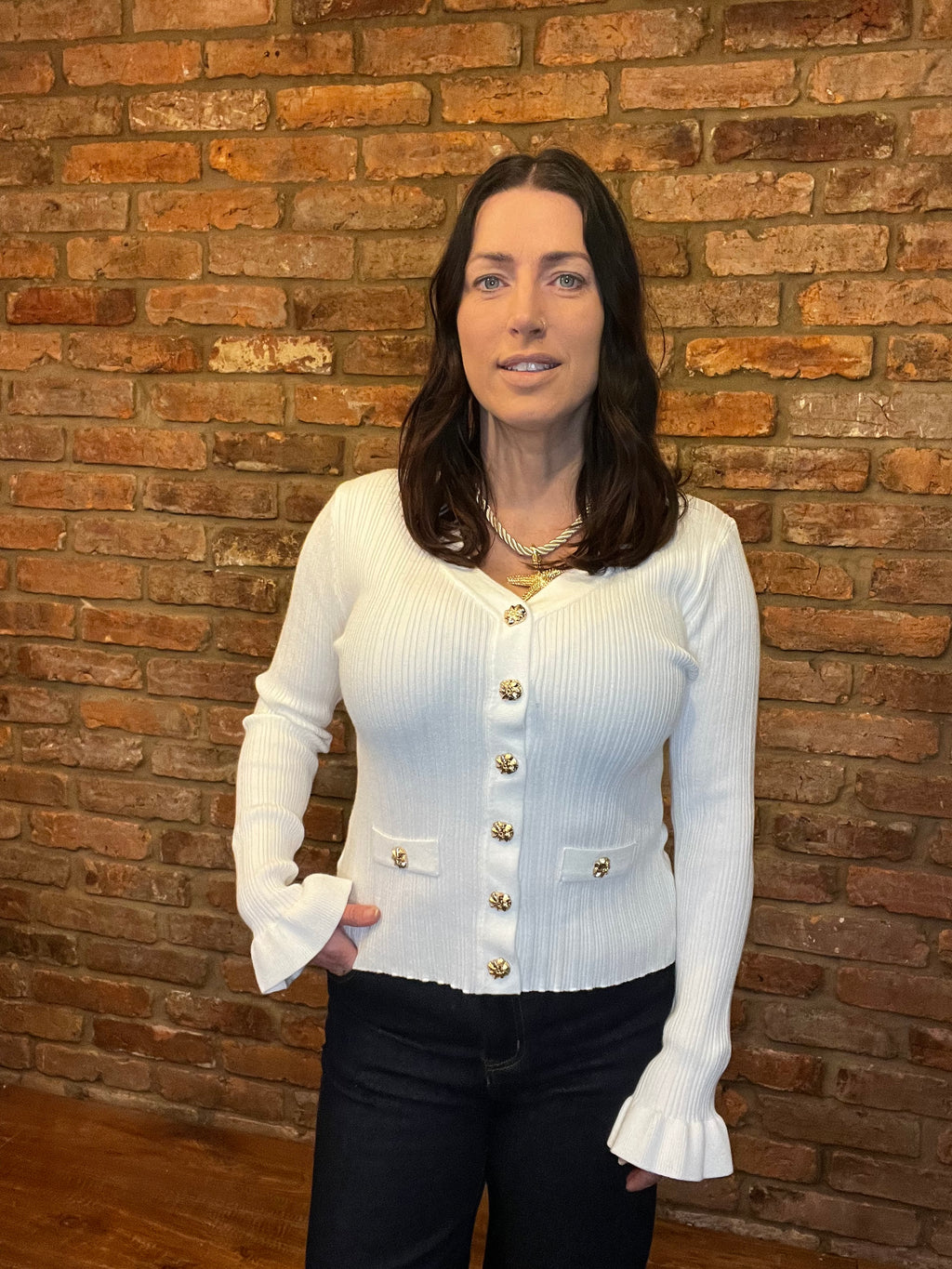 White knitted top with long frill sleeves