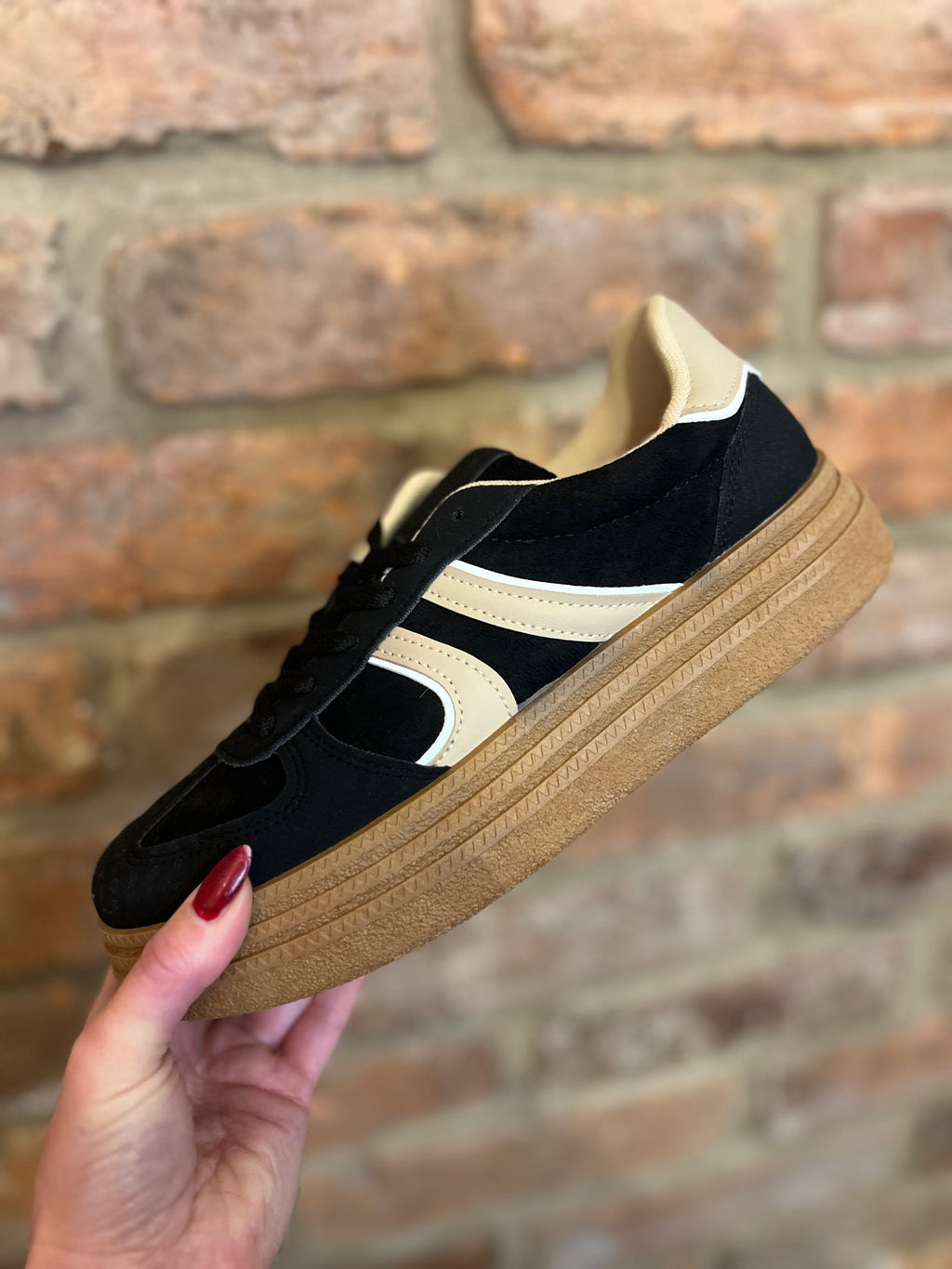 Black and cream trainers
