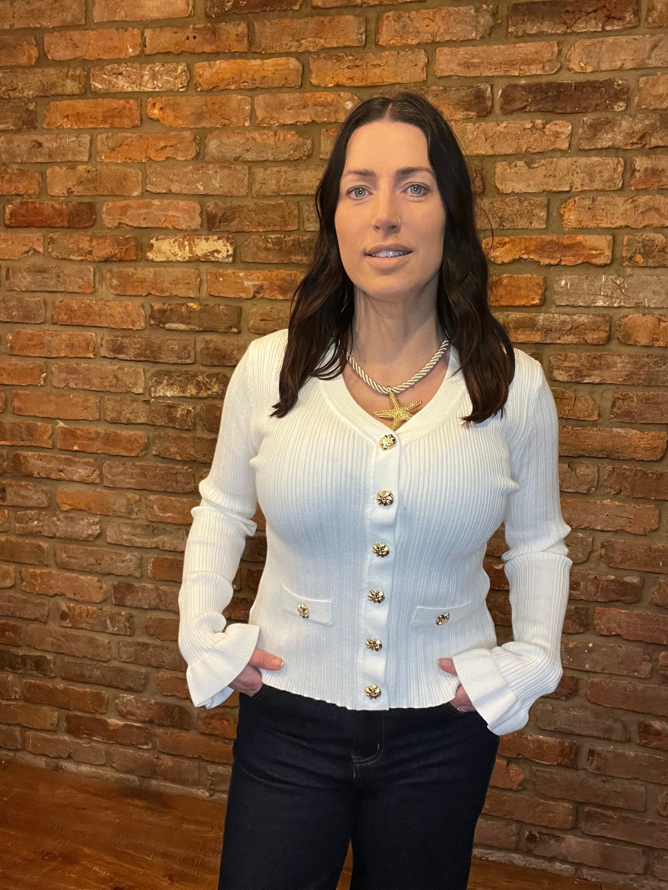 White knitted top with long frill sleeves