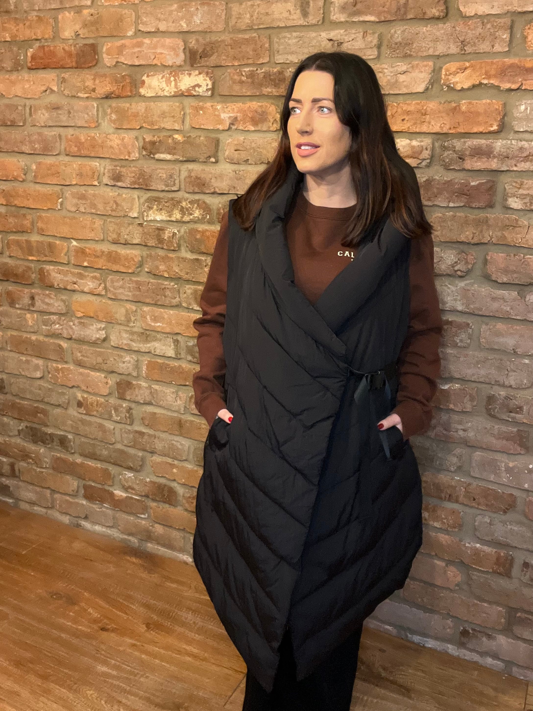 Sleeveless black hooded coat