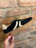 Black and cream trainers