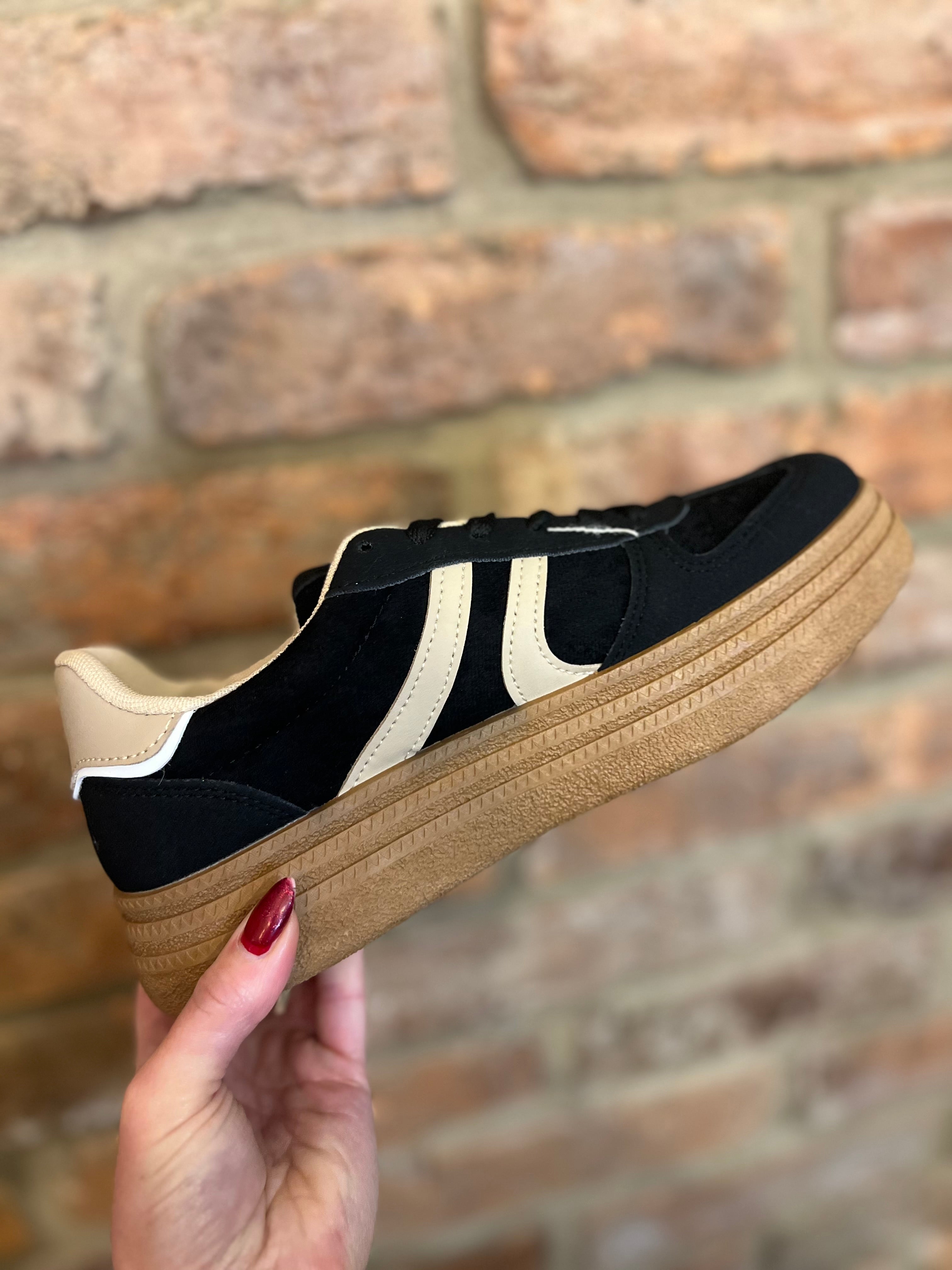Black and cream trainers