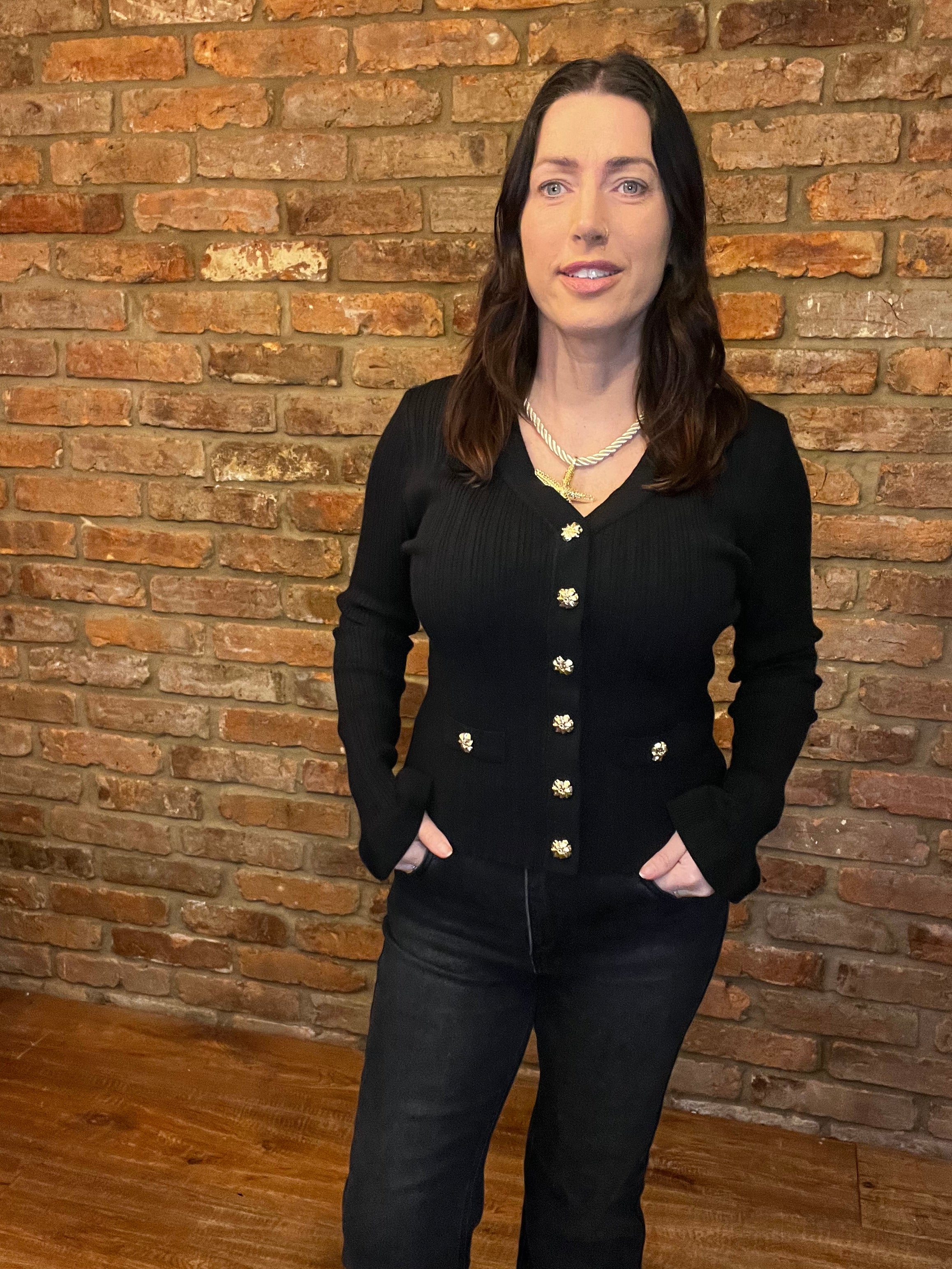 Black long sleeved knitted top with frill sleeves