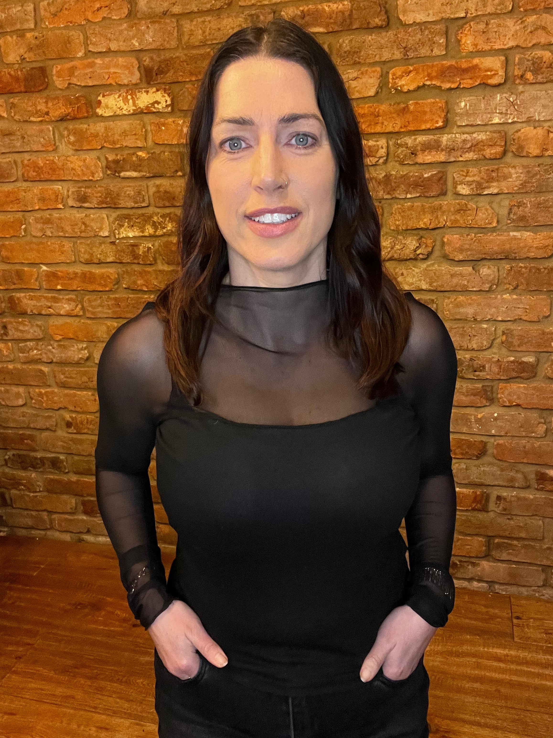 Black corset top with mesh sleeves